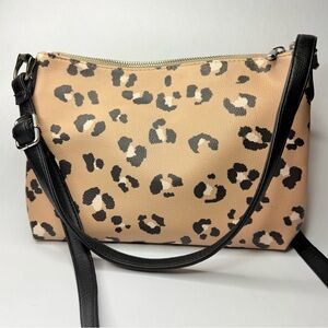 Cheetah Print Tan and black faux leather crossbody bag with adjustable strap.